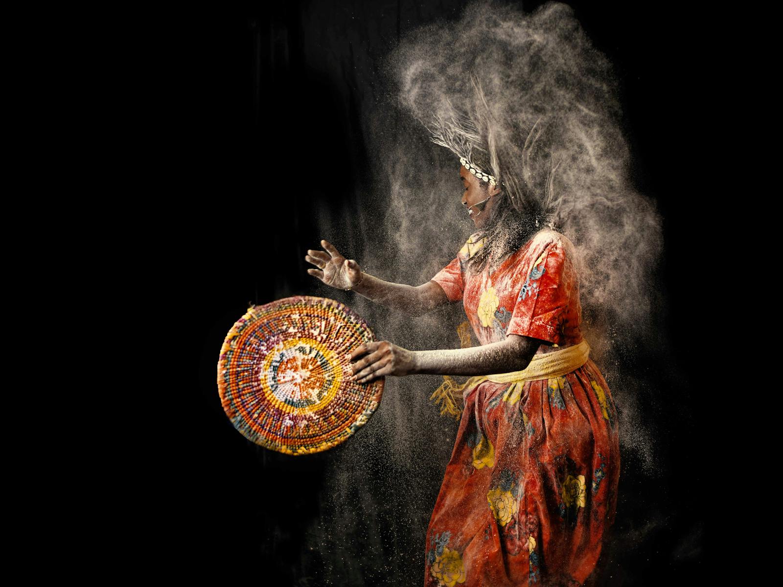 Woman in Traditional African Dress paracticing hoodoo ritual