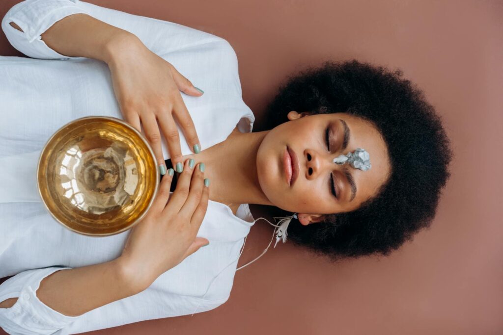 Tibetan Singing Bowl on a Woman's Chest Lying on the Ground